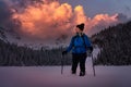 Adventure woman is hiking in the beautiful Snowy Landscape Royalty Free Stock Photo