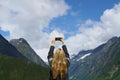 Adventure woman taking photo smart phone of glacial valley landscape on travel exploration for social media Royalty Free Stock Photo