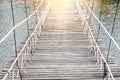 Adventure wooden rope suspension bridge in jungle