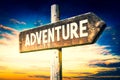 Adventure - wooden signpost, roadsign with one arrow Royalty Free Stock Photo