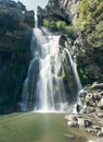 Adventurer at the base of 115m high waterfall of Salt de Sallent Barcelona.