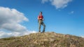 Adventurer holding camera on the peak of Malvern Hills, Worcestershire, United Kingdom Royalty Free Stock Photo