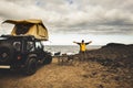 Adventurer man in journey travel with off road car and roof tent to enjoy freedom and explorer concept. discover the world living Royalty Free Stock Photo