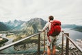 Adventurer man with red backpack enjoying mountains scenery Royalty Free Stock Photo