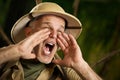 Adventurer shouting in the jungle Royalty Free Stock Photo