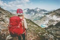 Adventurer tourist hiking in mountains with backpack Travel Lifestyle hiking adventure concept summer vacations outdoor exploring Royalty Free Stock Photo