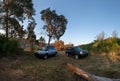 Adventures Camping tourism suv off road cars. Background lake, river an mountains. Landscape outdoor in morning, summer day. Roof Royalty Free Stock Photo