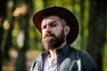 Adventures of cowboy. Man bearded cowboy nature background defocused. Brutal cowboy with long beard. Hipster tourist