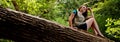 Adventuress on a log Royalty Free Stock Photo