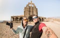 Adventurous best friends taking selfie at abandoned place in Tenerife