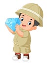 an adventurous boy is delighted to find a large diamond