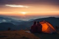 Adventurous couple cherishes mountain view from tent during camping