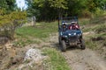 Adventurous driving of ATV motorbikes. A man drives a quad bike on dangerous roads