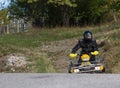 Adventurous driving of ATV motorbikes. A man drives a quad bike on dangerous roads