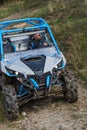 Adventurous driving of ATV motorbikes. A man drives a quad bike on dangerous roads