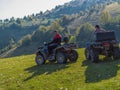 Adventurous driving of ATV motorbikes. Two man driving a quad bike on dangerous roads