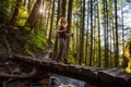 Adventurous Girl Hiking in a Green and Vibrant Rain Forest Royalty Free Stock Photo