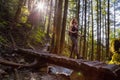 Adventurous Girl Hiking in a Green and Vibrant Rain Forest Royalty Free Stock Photo