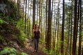 Adventurous Girl Hiking in a Green and Vibrant Rain Forest Royalty Free Stock Photo