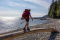 Adventurous girl hiking Juan de Fuca Trail