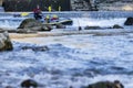 adventurous group doing white water rafting the rapids of river