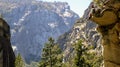 An adventurous guy sitting on the edge of a cliff