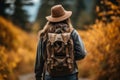 Adventurous hiker woman exploring the enchanting autumn forest trail amidst the vibrant fall foliage