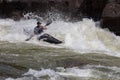 Adventurous kayaker paddling through the rough rapids on the Gauley River in West Virginia