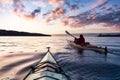 Adventurous Man Sea Kayaking in the Pacific Ocean. Royalty Free Stock Photo