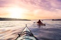 Adventurous Man Sea Kayaking in the Pacific Ocean. Royalty Free Stock Photo