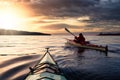 Adventurous Man Sea Kayaking in the Pacific Ocean. Royalty Free Stock Photo