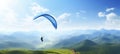 Adventurous man soaring through the sky, experiencing the thrill of solo paragliding on a sunny day