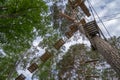 Adventurous outdoor activity at an elevated aerial forest climbing challenge course