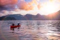 Adventurous people on a canoe are enjoying the Canadian Mountain Landscape