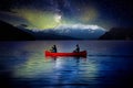 Adventurous People on a Red Canoe in a Lake.