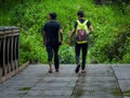Adventurous teens exploring lush Uttarakhand hills in monsoon. Nature\'s wonders await