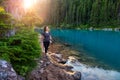 Adventurous White Caucasin Adult Woman Hiking on a trail in Canadian Nature