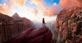 Adventurous Woman at the edge of a cliff is looking at a beautiful landscape view in the Canyon