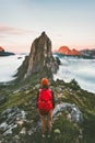 Adventurous woman enjoying sunset Segla mountain