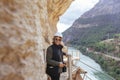 Adventurous woman with helmet taking pictures on her holidays Royalty Free Stock Photo