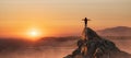 Adventurous Woman Hiking on the Rocky Coast with Mountains and Dramatic Sunset Sky. Royalty Free Stock Photo