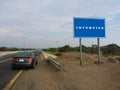 Advertise - Blank blue sign on a large pole against blue sky Royalty Free Stock Photo