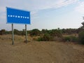 Advertise - Blank blue sign on a large pole against blue sky