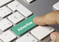 Advertise - Inscription on Green Keyboard Key