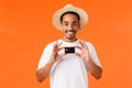 Advertisement, vacation and finance concept. All you need is this bank. Cheerful smiling african-american guy in summer Royalty Free Stock Photo