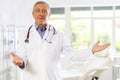 Mature male doctor represents services provided in medical clinic