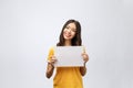 Advertising banner sign - woman excited pointing looking empty blank billboard paper sign board. Young business woman Royalty Free Stock Photo