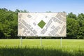 Advertising billboard immersed in a rural scene with a cadastral map on it - concept image