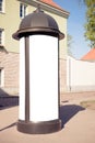 Advertising column stand mockup. Public information board in the street. Royalty Free Stock Photo