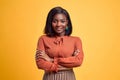 Advertising concept. Confident and smiling young african american woman crossed hands on chest, looking at camera and standing on Royalty Free Stock Photo